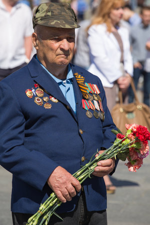 UKRAINE, KIEV - MAY 9: Ceremonial parade at Kiev main street - Khreschatyk - dedicated to the 68th Anniversary of victory in Great Patriotic War (World War II). Parade of victory on May 9, 2013 in Kiev, Ukraine.のeditorial素材