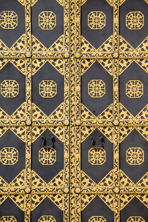 Ornamented gold door. Golden decoration of the door to Cathedral of the Dormition in Kiev Pechersk Lavra - famous monastery inscribed on UNESCO world heritage list. Ukrainian landmark.のeditorial素材