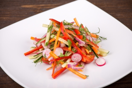 Fresh vegetable salad in white plateの写真素材