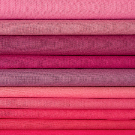 Heap of cloth fabrics at a local market in India. Close up .の写真素材