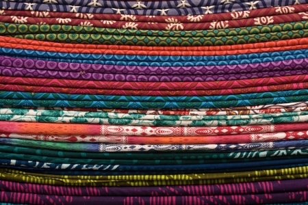Heap of cloth fabrics at a local market in India. Close up .の写真素材