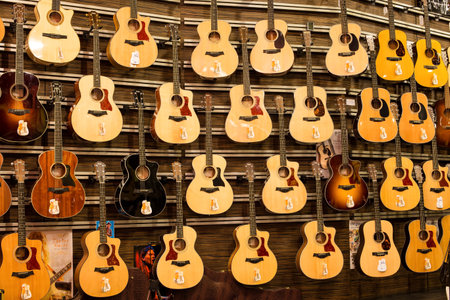 BANGKOK - NOVEMBER 19: Large assortment of guitars at the Siam Paragon Mall on Nov 19, 2013 in Bangkok, Thailand. Siam Paragon is a one of the biggest shopping centres in Asia.のeditorial素材