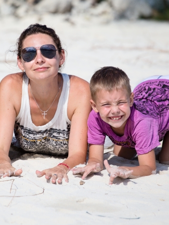 Happy family enjoy summer day at the beachの写真素材