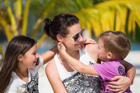 Happy family enjoy summer day at the beachの写真素材