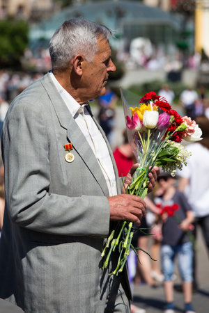 KIEV, UKRAINE - MAY 9, 2013: Ceremonial parade at Kiev main street Khreschatyk dedicated to the 68th anniversary of victory in Great Patriotic War ( World War II ). Unidentified participantのeditorial素材