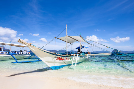 EL NIDO, PHILIPPINES - JANUARY 31, 2014 : Boats waiting for tourists to travel between the islands. El Nido is one of the top tourist destinations in the world.のeditorial素材