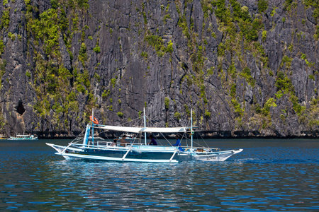 EL NIDO, PHILIPPINES - FEBRUARY 04, 2014 : Boats waiting for tourists to travel between the islands. El Nido is one of the top tourist destinations in the world.のeditorial素材