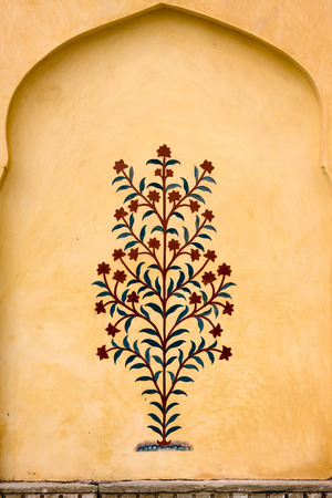 Indian ornament on wall of palace in Jaipur fort Indiaの写真素材