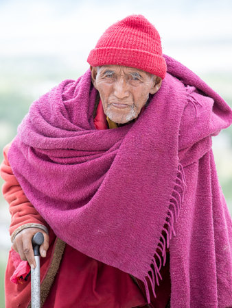 TIKSEY, INDIA - SEPTEMBER 08 2014: Old unidentified Tibetan Buddhist monk in the monastery of Tiksey...