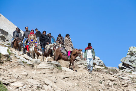 ROHTANG, INDIA - SEPTEMBER 17 2014: Unidentified tourists having fun on the Rohtang Pass, which is on the road Manali - Leh.  India, Himachal Pradeshのeditorial素材