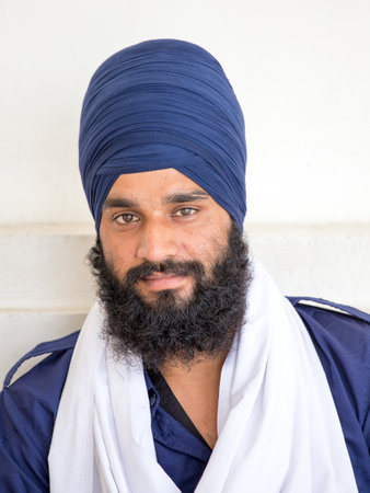 AMRITSAR, INDIA - SEPTEMBER 27, 2014: Unidentified Sikh man visiting the Golden Temple in Amritsar,...