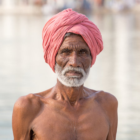 AMRITSAR, INDIA - SEPTEMBER 27, 2014: Unidentified Sikh man visiting the Golden Temple in Amritsar,...
