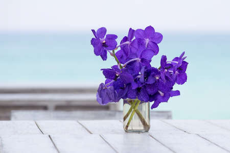 Close up beautiful bouquet of orchids flower on a background of the sea
