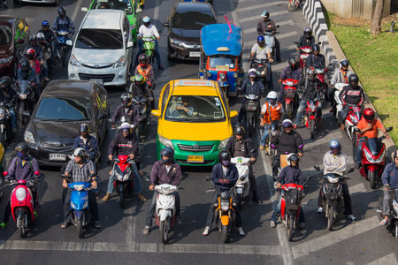 BANGKOK, THAILAND - JANUARY 22, 2015: Traffic moves slowly along a busy road in Bangkok, Thailand. Annually an estimated 150,000 new cars join the already heavily congested streets of Bangkok.のeditorial素材