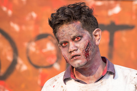 BANGKOK,THAILAND - JANUARY 8, 2015: Unknown Thai guy participates in "FOX Thai The Walking Dead Season 5 Marathon" dressed as zombiesのeditorial素材