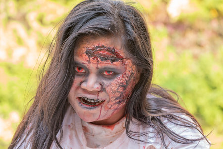 BANGKOK,THAILAND - JANUARY 8, 2015: Unknown Thai girl participates in "FOX Thai The Walking Dead Season 5 Marathon" dressed as zombiesのeditorial素材