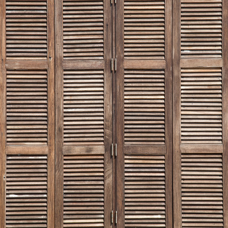 Background latticed wooden doors in the tropical houseの写真素材