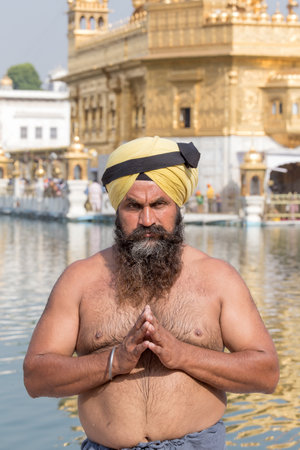 AMRITSAR, INDIA - SEPTEMBER 29, 2014: Unidentified Sikh man visiting the Golden Temple in Amritsar,...