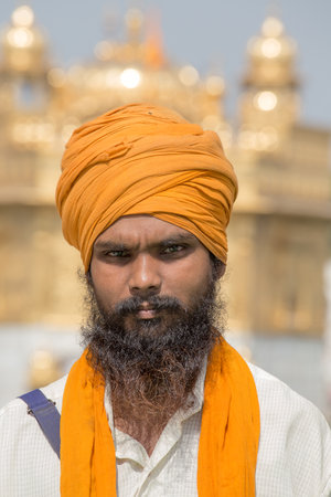 AMRITSAR, INDIA - SEPTEMBER 29, 2014: Unidentified Sikh man visiting the Golden Temple in Amritsar,...