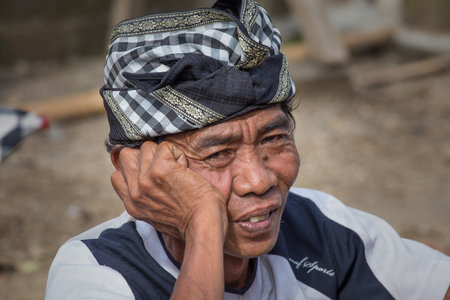 UBUD, INDONESIA - FEBRUARY 24, 2015 : Portrait of unidentified man to Bali island. Inhabitants of Bali are kind and friendly even in old ageのeditorial素材