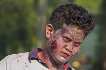BANGKOK,THAILAND - JANUARY 8, 2015: Unknown Thai guy participates in "FOX Thai The Walking Dead Season 5 Marathon" dressed as zombiesのeditorial素材
