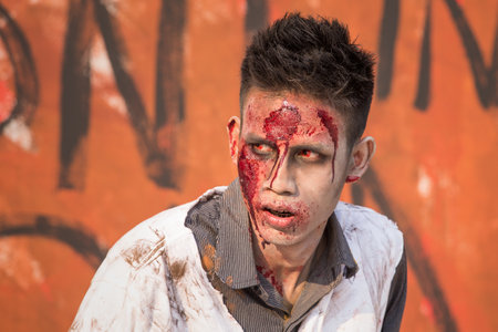 BANGKOK,THAILAND - JANUARY 8, 2015: Unknown Thai guy participates in "FOX Thai The Walking Dead Season 5 Marathon" dressed as zombiesのeditorial素材