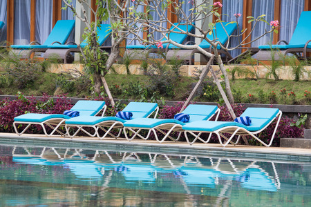 Relaxing lounge chairs by the swimming pool