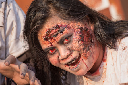 BANGKOK,THAILAND - JANUARY 8, 2015: Unknown Thai girl participates in "FOX Thai The Walking Dead Season 5 Marathon" dressed as zombiesのeditorial素材