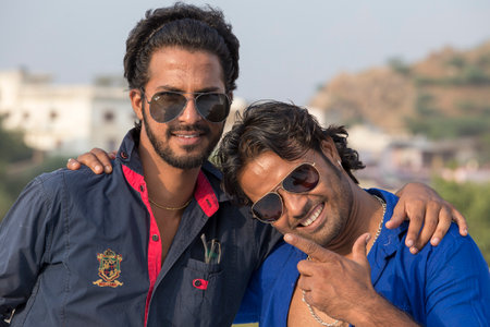 PUSHKAR, INDIA - OCTOBER 28, 2014: Unidentified two Indian man attended the annual Pushkar Camel Mela. This fair is the largest camel trading fair in the world.のeditorial素材
