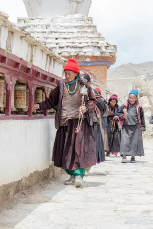 LAMAYURU, INDIA - JUNE 15, 2015: Unidentified buddhist old women during Tsam mystery in time of Yuru Kabgyat festival at Lamayuru Gompa, Ladakh, North Indiaのeditorial素材