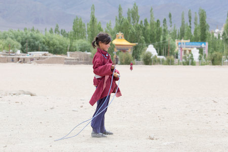 LEH, INDIA - JUNE 24, 2015: Unidentified Tibetan students in a lesson on Sport in Druk White Lotus Schoolのeditorial素材
