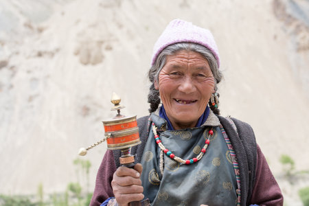 LAMAYURU, INDIA - JUNE 13, 2015: Unidentified buddhist old women during Tsam mystery in time of Yuru Kabgyat festival at Lamayuru Gompa, Ladakh, North Indiaのeditorial素材