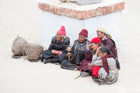 LAMAYURU, INDIA - JUNE 13, 2015: Unidentified buddhist old women during Tsam mystery in time of Yuru Kabgyat festival at Lamayuru Gompa, Ladakh, North Indiaのeditorial素材