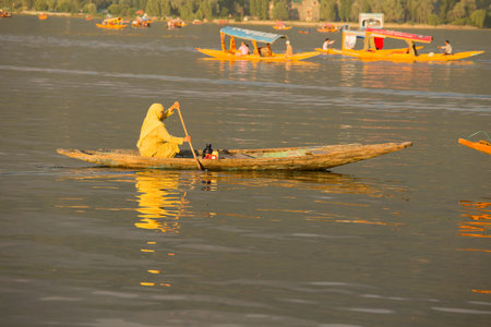 SRINAGAR, INDIA - JULY 02, 2015 : Lifestyle in Dal lake, local people use 'Shikara', a small boat for transportation in the lake of Srinagar, Jammu and Kashmir state, Indiaのeditorial素材