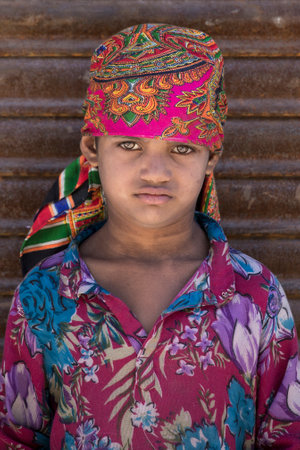 SRINAGAR, INDIA - JUNE 12, 2015: Unidentified beggar girl begs for money from a passerby in...