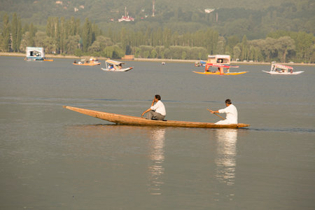 SRINAGAR, INDIA - JULY 02, 2015 : Lifestyle in Dal lake, local people use 'Shikara', a small boat...