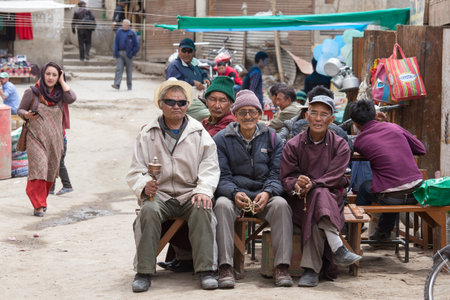 LEH, INDIA - JUNE 24, 2015: Unidentified tibetan people on the street in Leh, Ladakh.のeditorial素材
