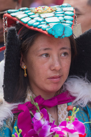 HEMIS, INDIA - JUNE 27, 2015: Unidentified tibetan buddhist woman in national dress during Hemis Festival at Ladakh, North Indiaのeditorial素材