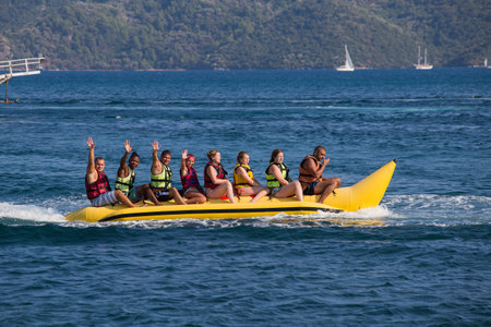 MARMARIS, TURKEY - AUGUST 22, 2015 : Unidentified happy people ride the inflatable watercraft boat. Sea attraction. Turkey is one of the most attractive destinations for touristsのeditorial素材