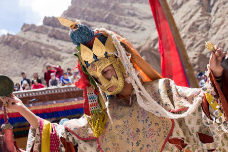 HEMIS, INDIA - JUNE 26, 2015: Tibetan lamas dressed in mystical mask dance Tsam mystery in time of...