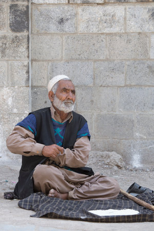 SRINAGAR, INDIA - JULY 03 2015: Unidentified Indian muslim man on the street. Kashmiris are fighting for their freedom for 20 years now. Kashmir became dangerous again.のeditorial素材