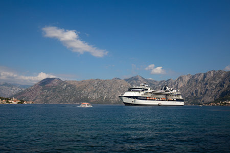 KOTOR, MONTENEGRO - SEPTEMBER 23, 2015 : Large cruise ship Celebrity Constellation in Boka Kotorsky Bay. Kotor has one of the best preserved medieval old towns in the Adriaticのeditorial素材