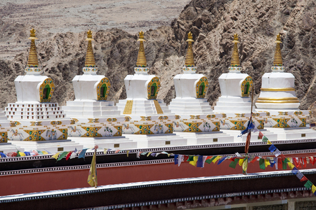 Buddhist white stupa and Himalayas mountains in the background in Thiksey Monastery in Leh , Ladakh,...