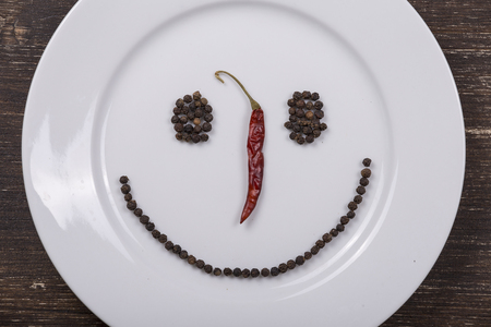 Happy smiley face on dish plate , close upの写真素材