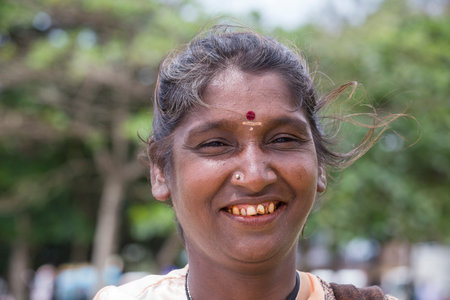 MATARA, SRI LANKA - NOVEMBER 5, 2014: Unknown Sri Lankan beggar woman waits for alms on a streetのeditorial素材