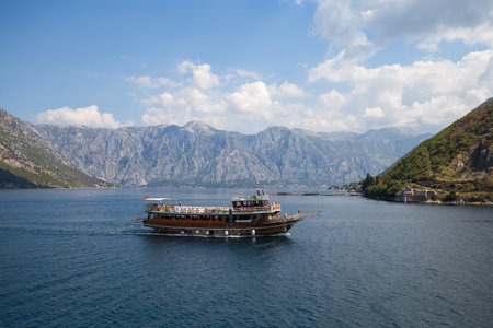 KOTOR, MONTENEGRO - SEPTEMBER 13, 2015 : Cruise ship with tourists in Boka Kotorska Bay. Kotor has...