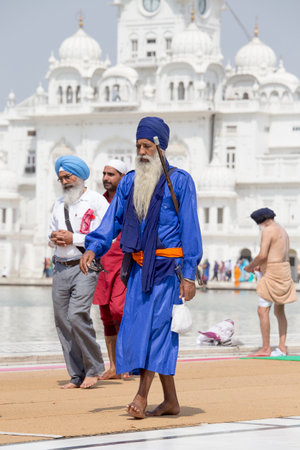 AMRITSAR, INDIA - SEPTEMBER 26, 2014: Unidentified Sikhs and indian people visiting the Golden...