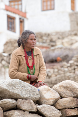 LEH, INDIA - JUNE 21, 2015: Unidentified beggar woman on the street in Leh, Ladakh. Poverty is a major issue in Indiaのeditorial素材