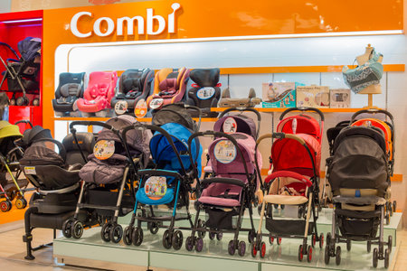 BANGKOK, THAILAND - JANUARY 7, 2016 : Section of baby carriages Combi in supermarket Siam Paragon. Siam Paragon is a one of the biggest shopping centres in Asia.のeditorial素材