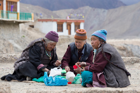 LAMAYURU, INDIA - JUNE 14, 2015: Unidentified buddhist old women during mystical mask dancing Tsam mystery dance in time of Yuru Kabgyat Buddhist festival at Lamayuru Gompa, Ladakh, North Indiaのeditorial素材